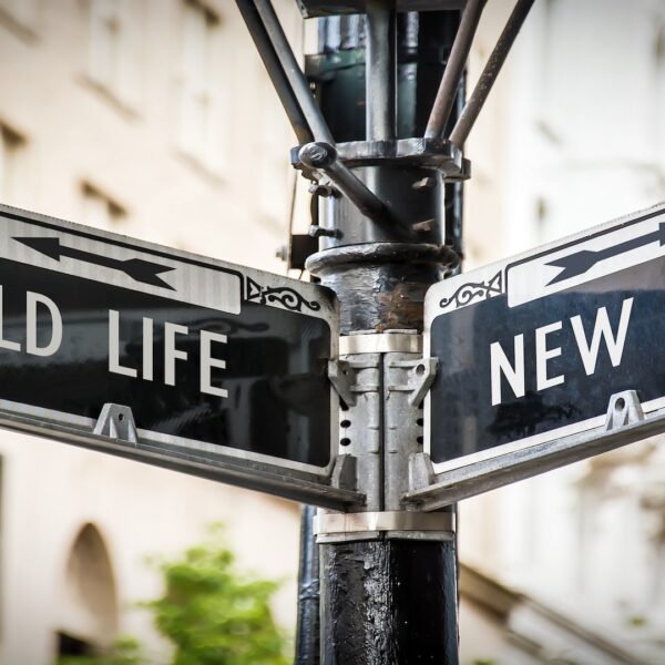 Street sign showing “Old Life” pointing one direction and “New Life” pointing another, symbolizing total life changes and major life transitions.