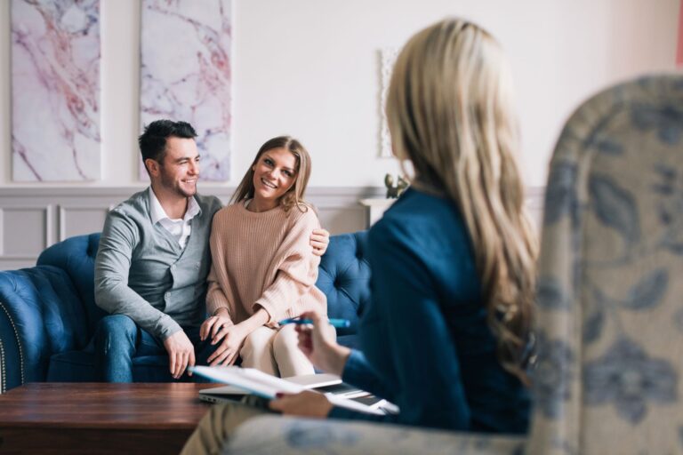 Couple attending premarital counseling session with therapist to strengthen communication and prepare for marriage